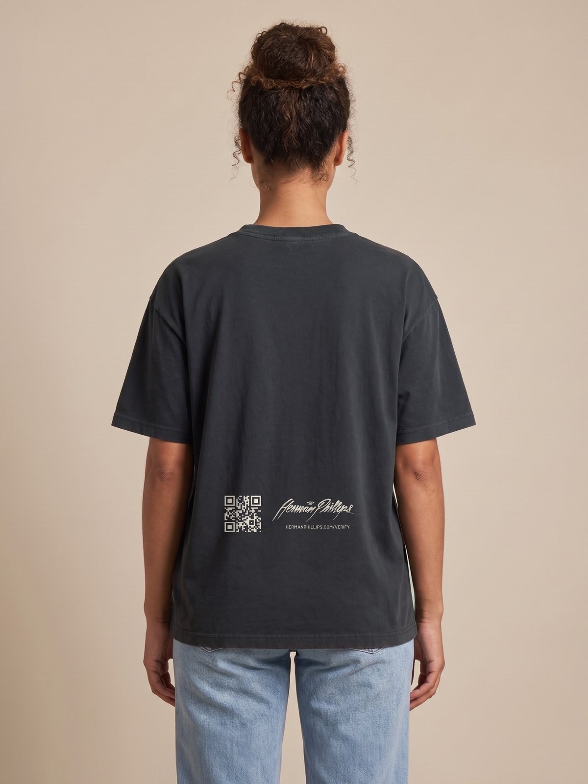Back of the washed black bear tee with the verification mark