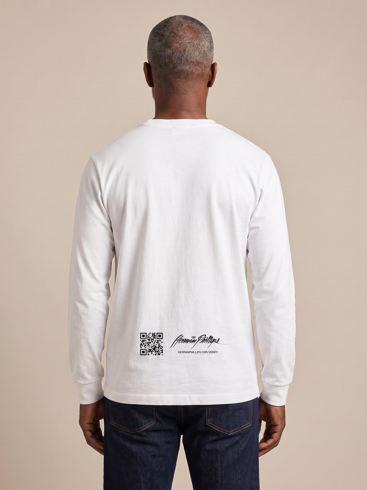 Back of the white long-sleeve tee with the verification mark
