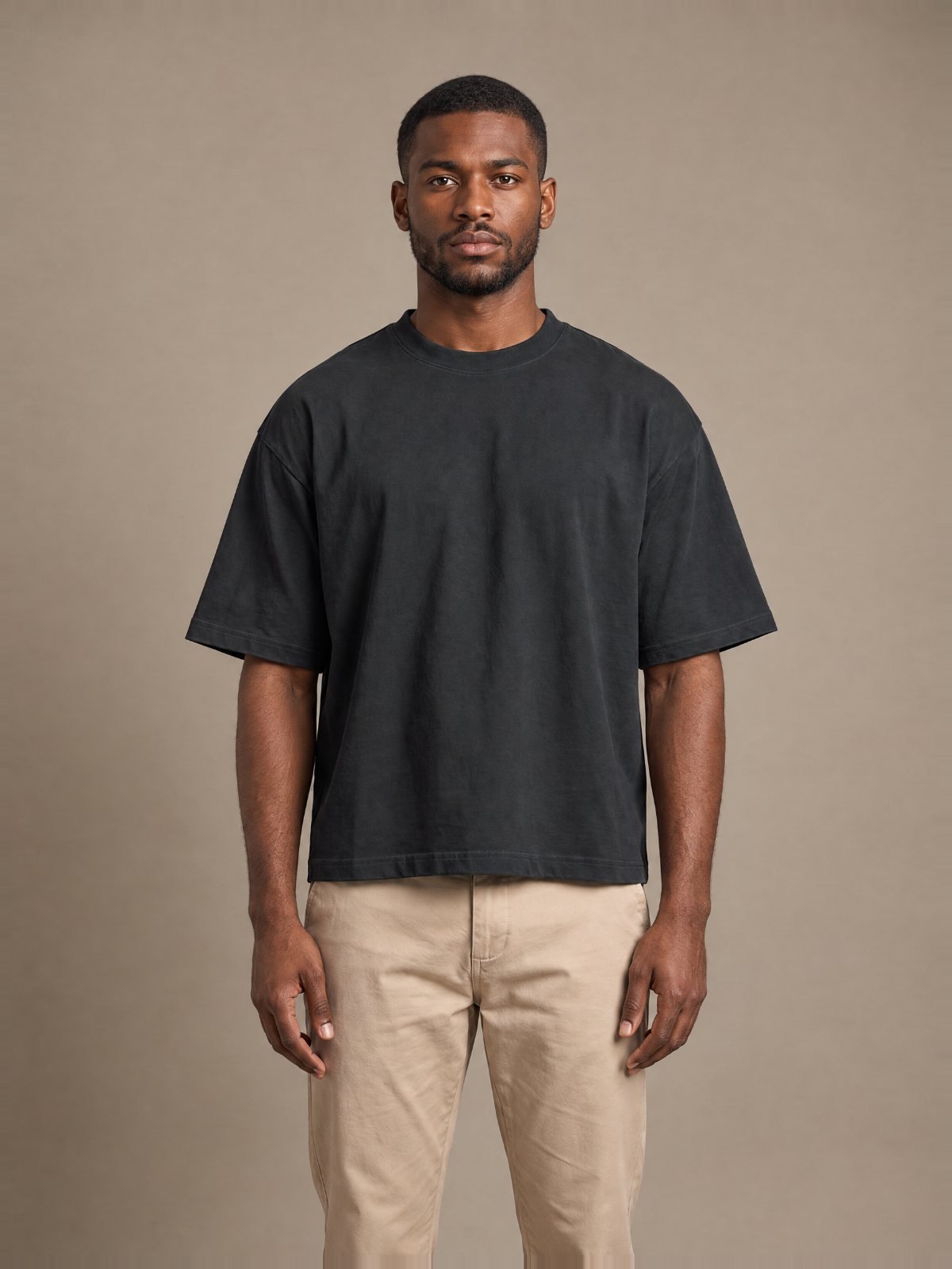 Model wearing the Herman Phillips blank black boxy tee, front