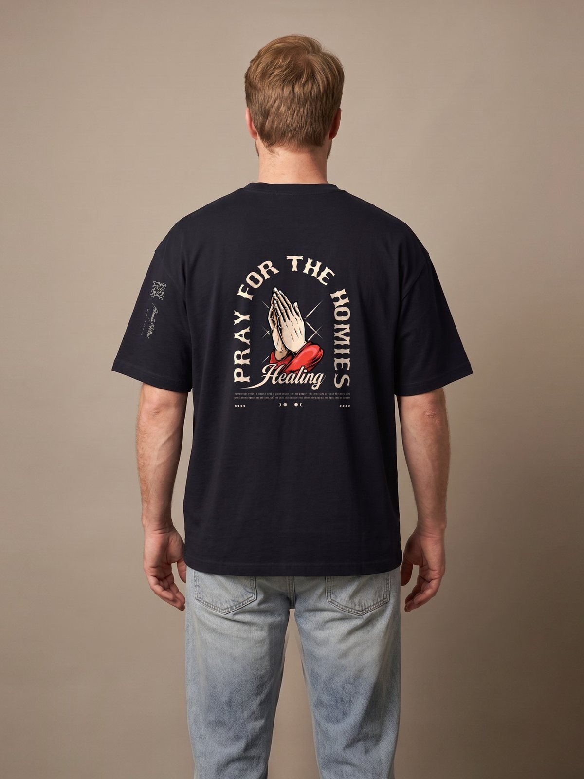 Back of the black oversized tee with the Pray for the Homies print