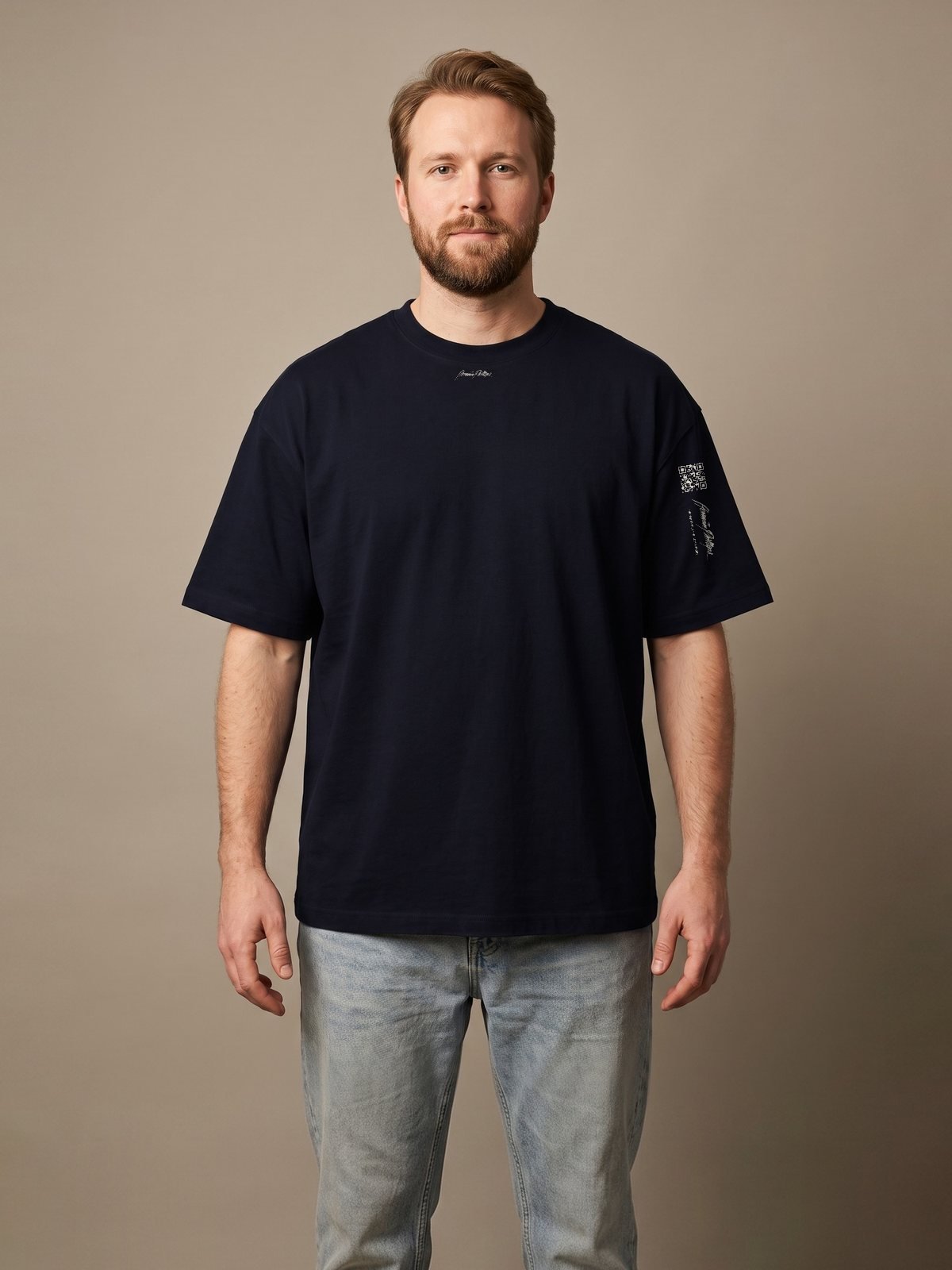 Model wearing the black oversized tee, Herman Phillips script on the chest
