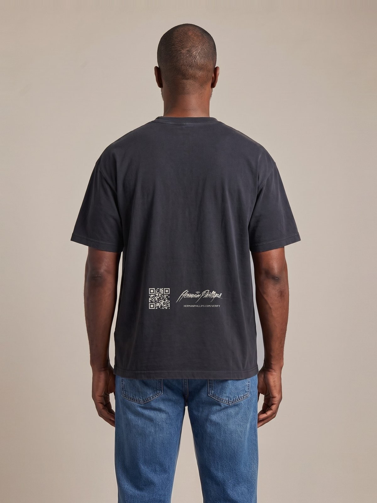 Back of the washed black tee with the verification mark